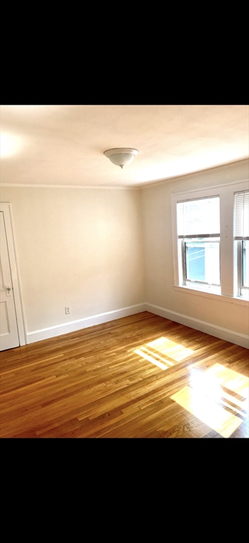 66 Brock Street, Unit 3 Boston, MA 02135 - Photo 10 of 15 a view of an ocean and a window