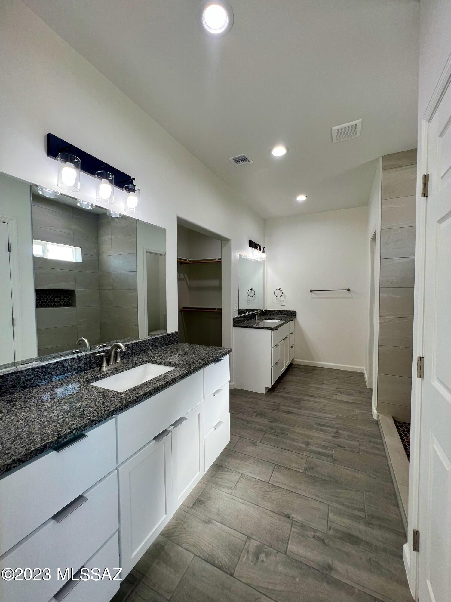 353 Dock Street Rio Rico, AZ 85648 - Photo 22 of 50 a large kitchen with a sink and stainless steel appliances