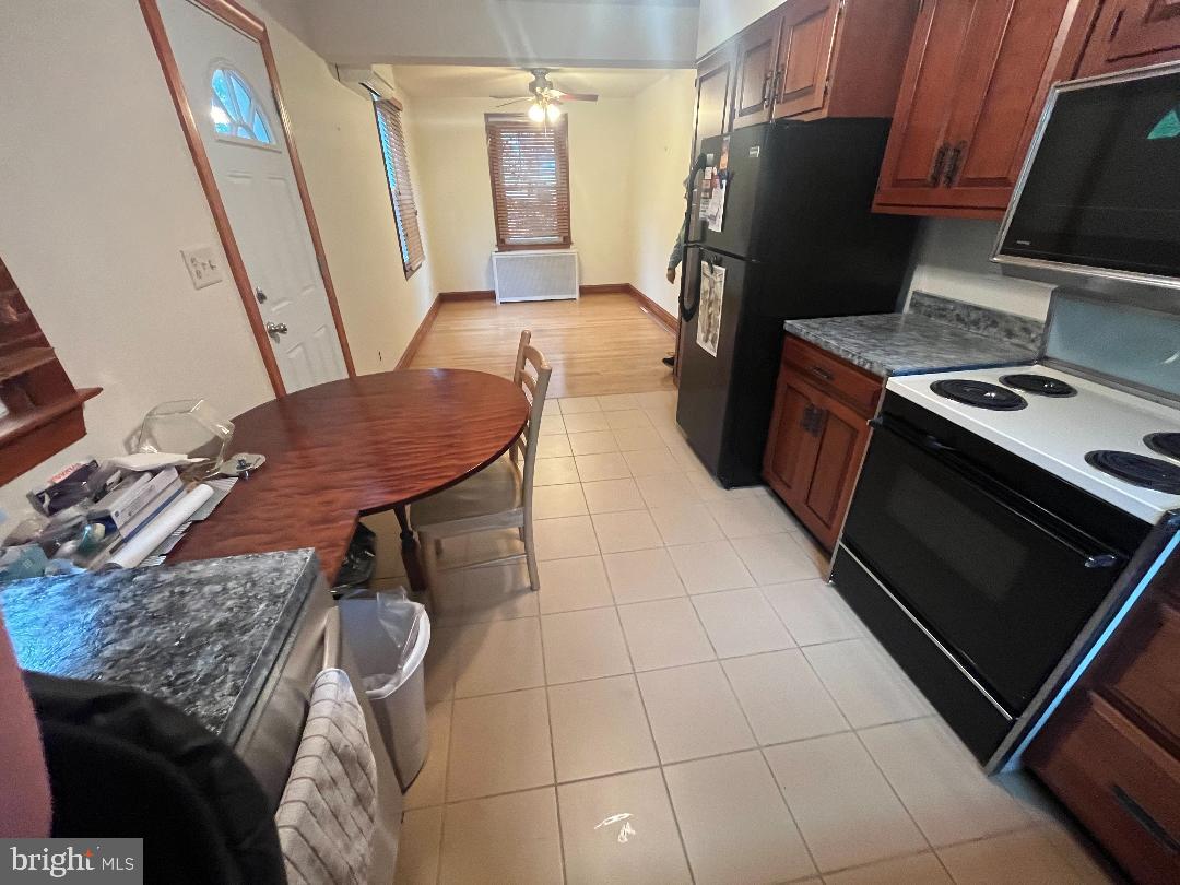 1240 Ten Oaks Road Baltimore, MD 21227 - Photo 6 of 18 Dining room is open to the kitchen