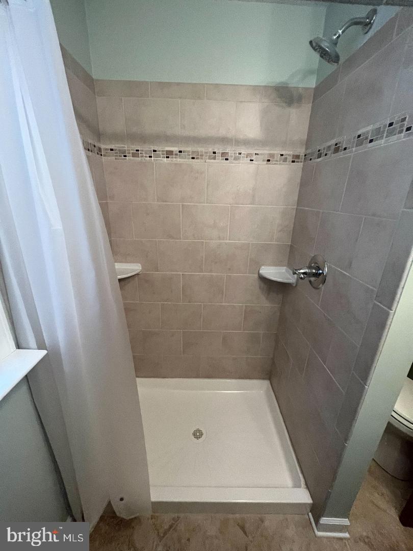 1240 Ten Oaks Road Baltimore, MD 21227 - Photo 9 of 18 1st floor ceramic tile bath