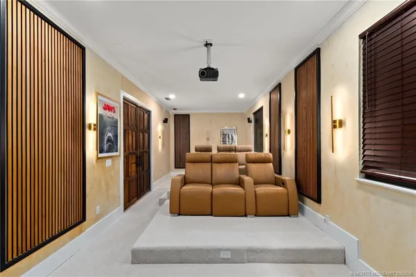 a living room with furniture and large window