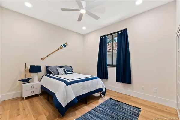 a kitchen with a sink a stove and cabinets