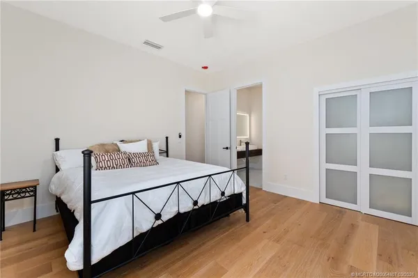 a view of a livingroom with a ceiling fan and window