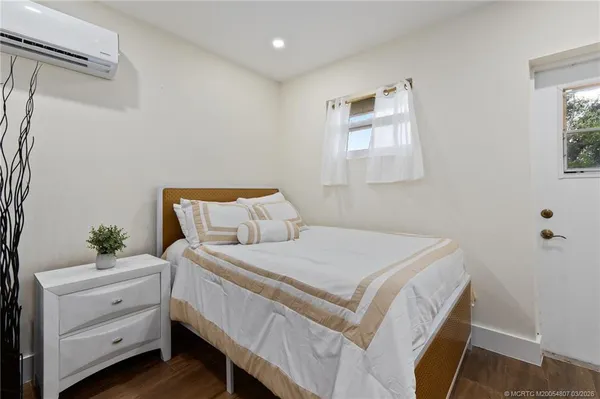 a lake view with a big yard and potted plants