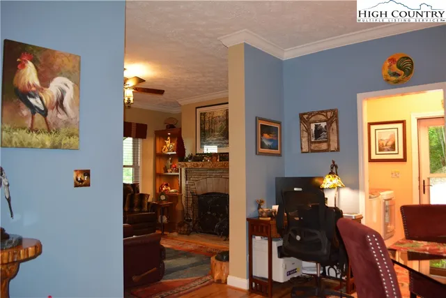 a kitchen with stainless steel appliances kitchen island granite countertop a stove a sink and a refrigerator