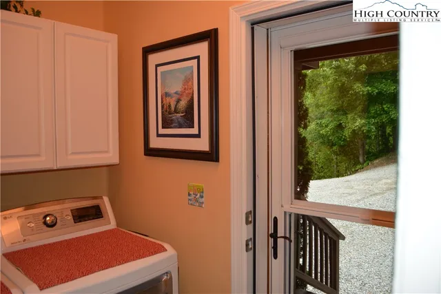 a bedroom with a bed and a lamp on table