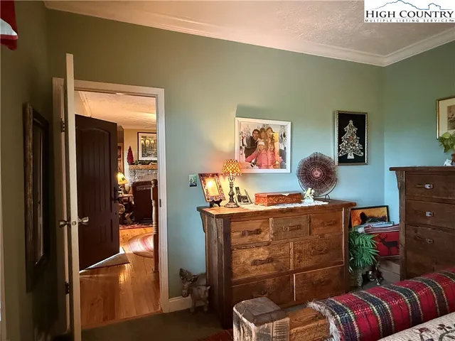 a bathroom with a granite countertop sink a mirror and shower