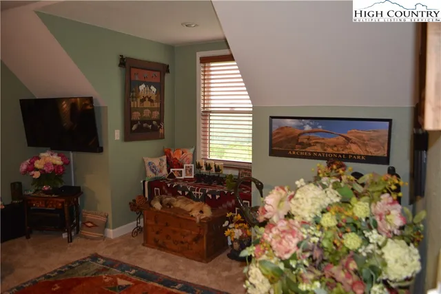 a view of backyard with outdoor seating and green space