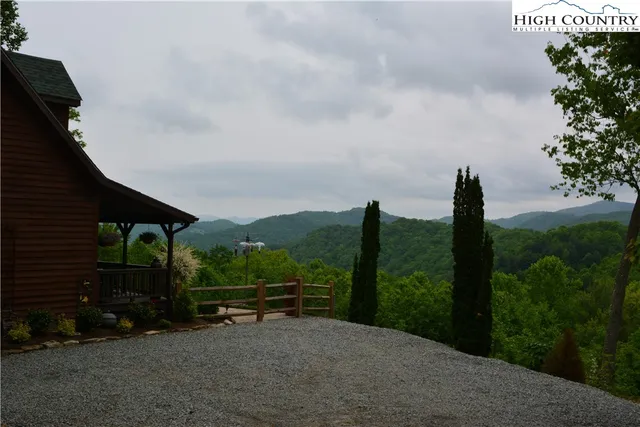 a view of a green field with lots of bushes