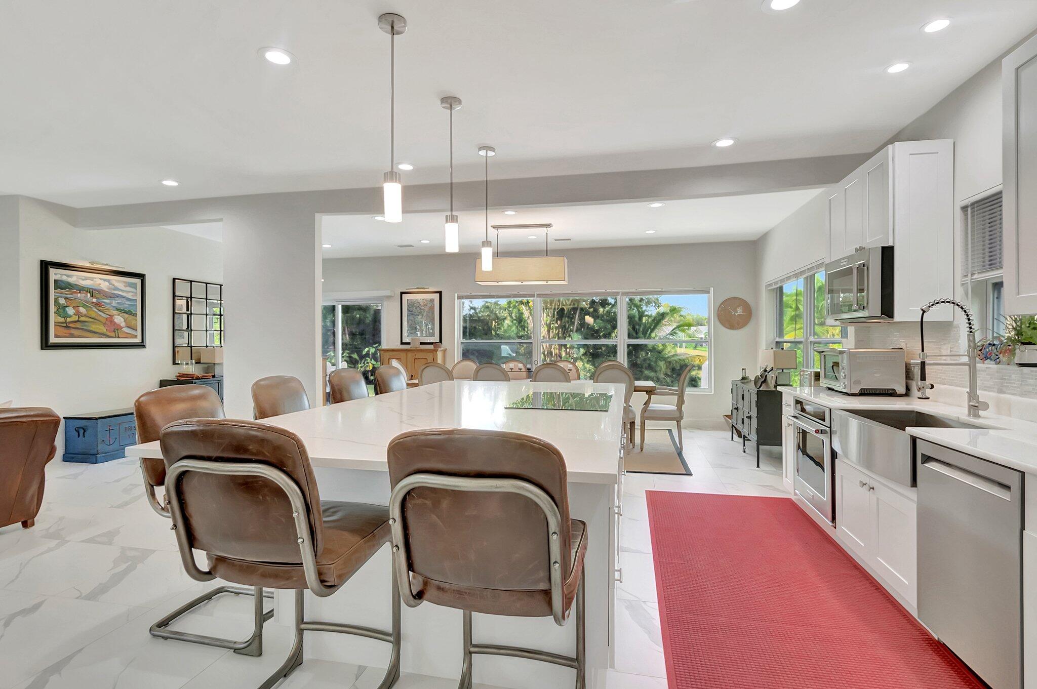 299 Northwest 10th Court Boca Raton, FL 33486 - Photo 11 of 42 a kitchen with granite countertop lots of counter top space