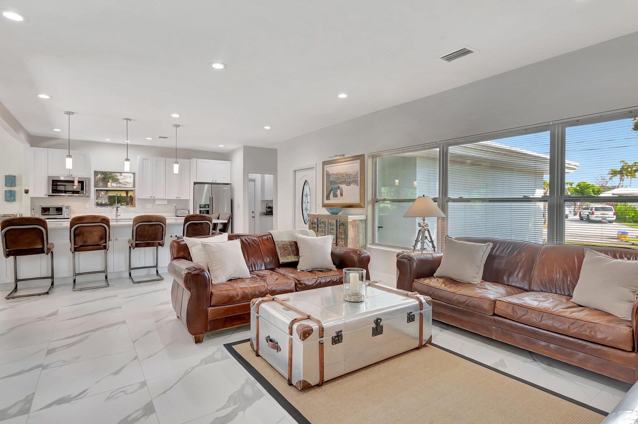 299 Northwest 10th Court Boca Raton, FL 33486 - Photo 16 of 42 a living room with furniture and a large window