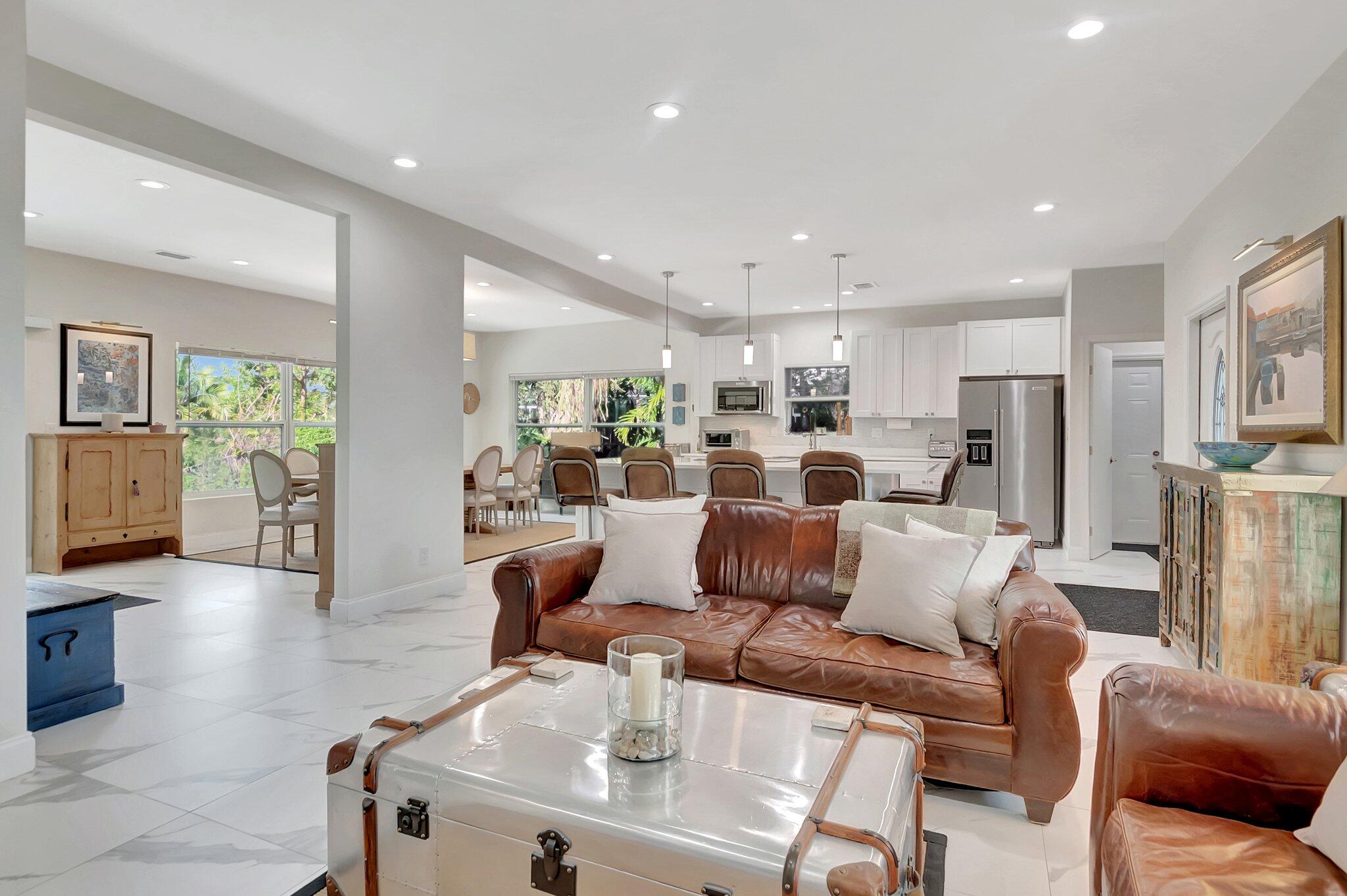 299 Northwest 10th Court Boca Raton, FL 33486 - Photo 17 of 42 a living room with furniture and a wooden floor