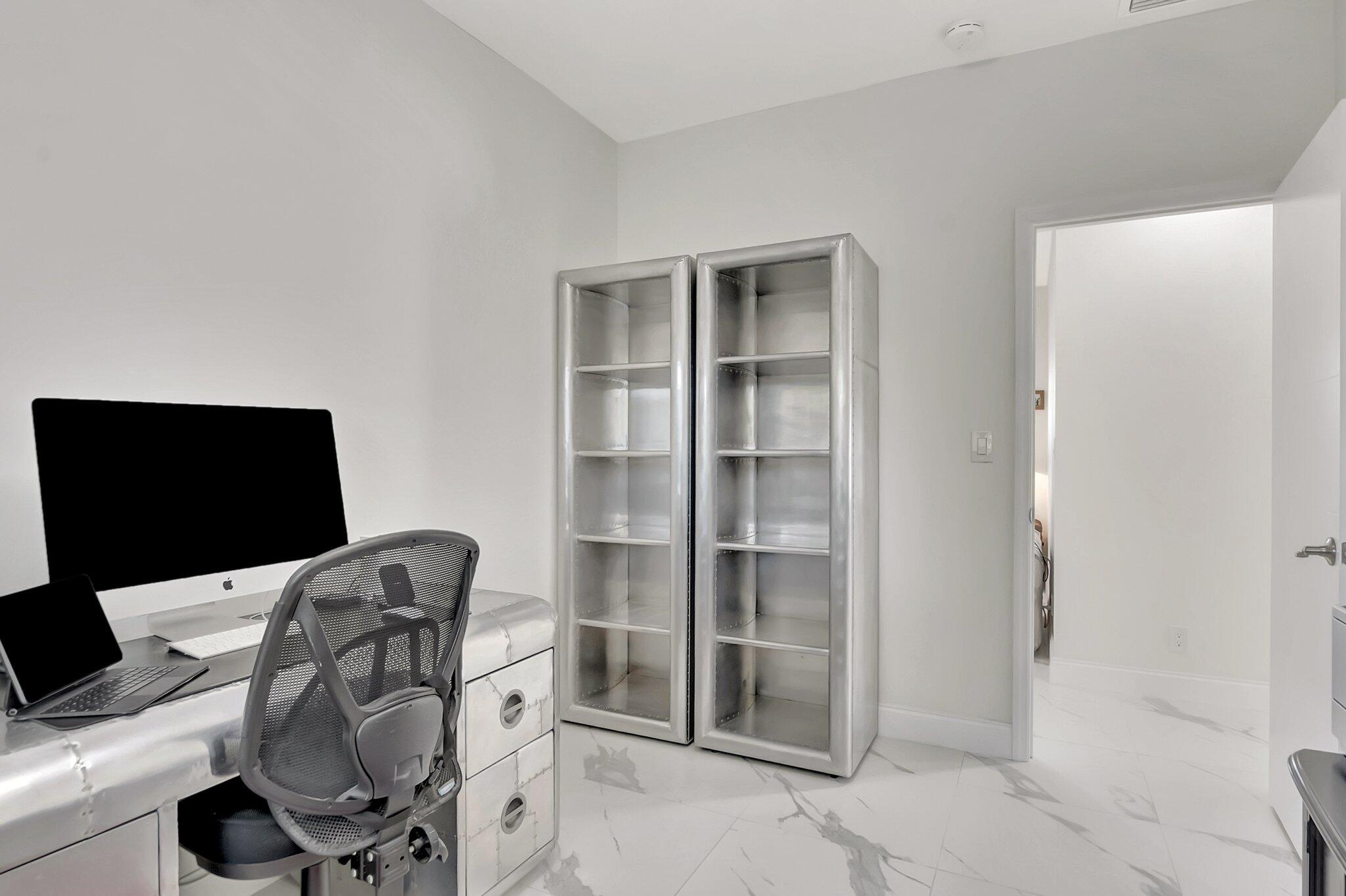 299 Northwest 10th Court Boca Raton, FL 33486 - Photo 27 of 42 a view of workspace with wooden floor shelves