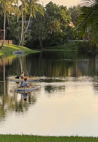 a view of a lake with a table and chairs