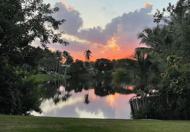 a view of a lake with houses in the back