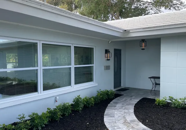 a front view of a house with a yard