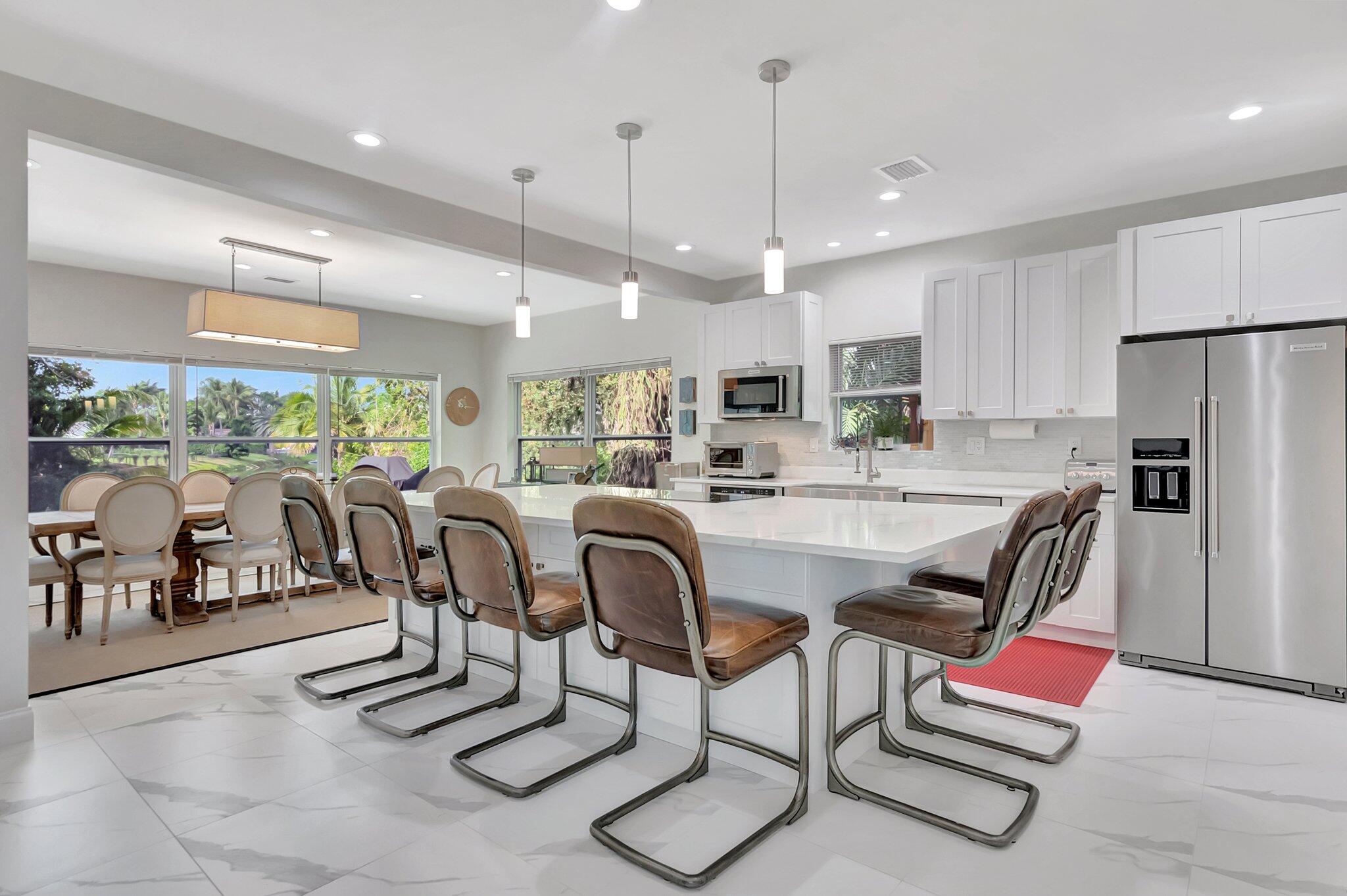 299 Northwest 10th Court Boca Raton, FL 33486 - Photo 7 of 42 a dinning room and kitchen with a large window