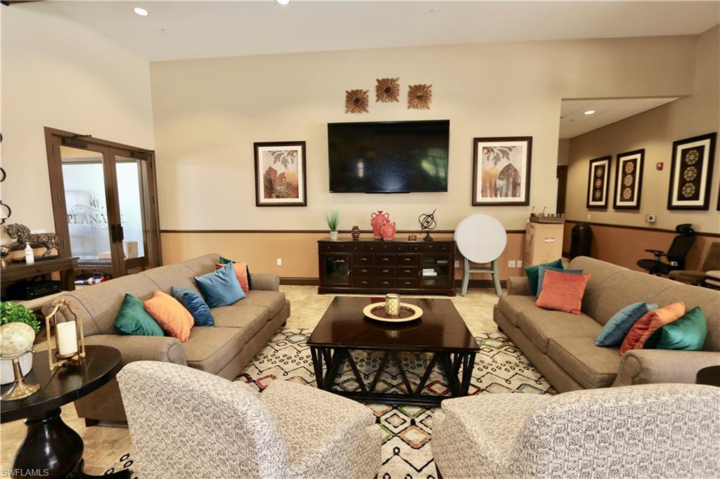 8437 Rosa Court Naples, FL 34114 - Photo 23 of 32 a living room with furniture and wooden floor