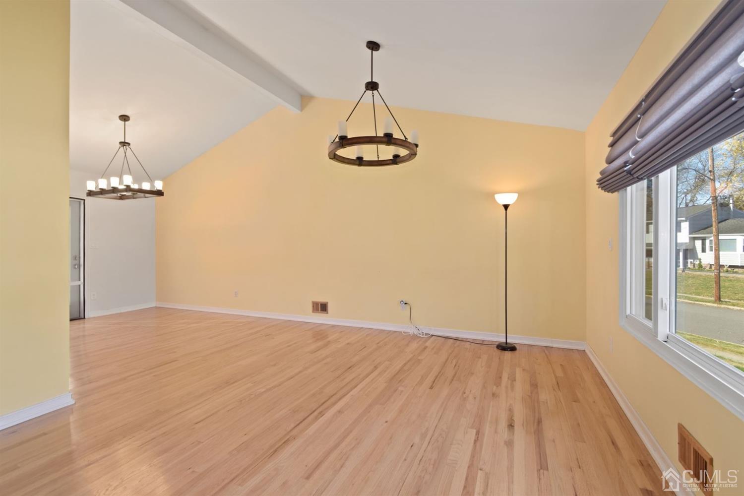50 Gramercy Road Old Bridge, NJ 08857 - Photo 9 of 23 a view of a room with wooden floor wooden floor and windows