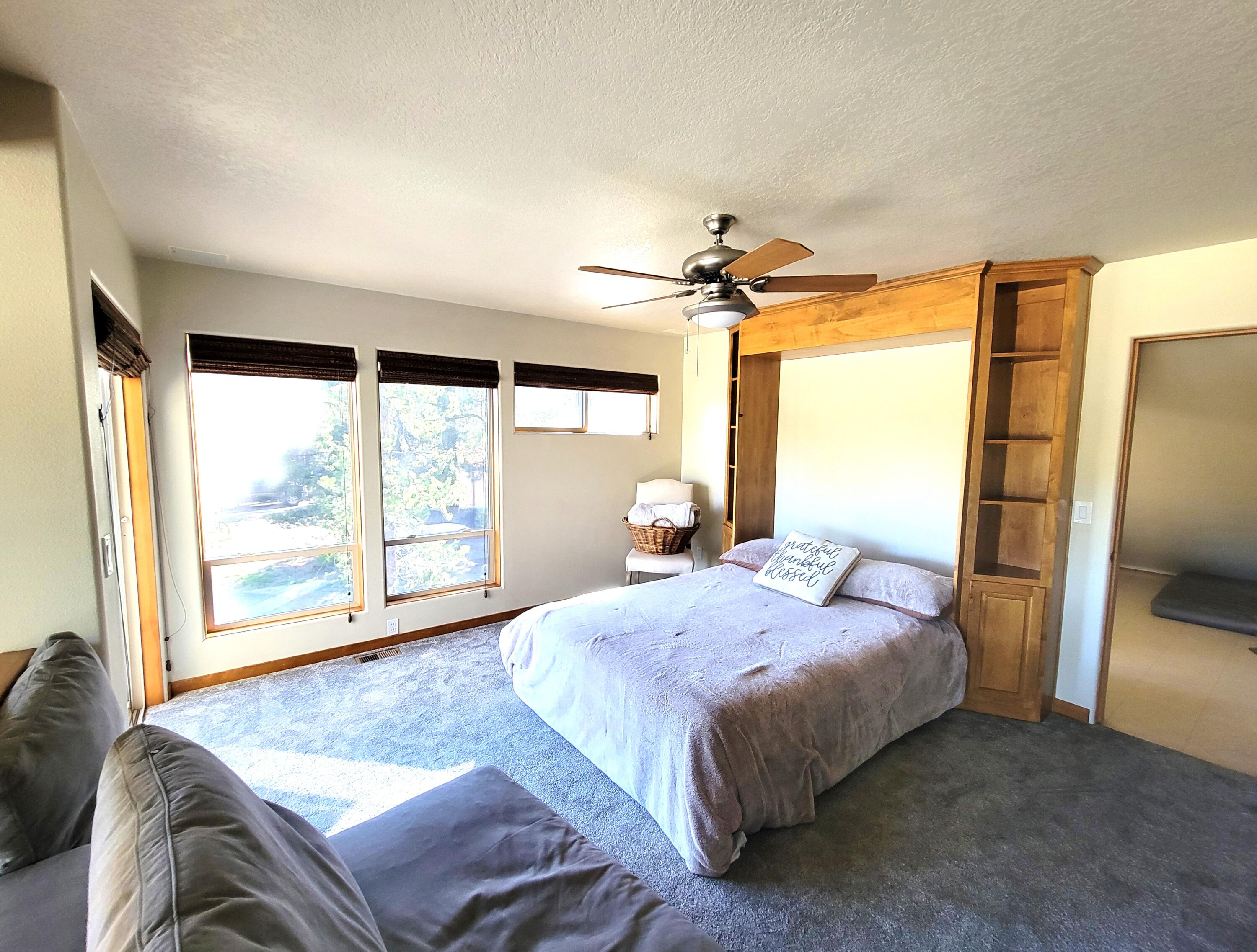 56065 Snow Goose Road Bend, OR 97707 - Photo 24 of 65 Great river views in this "Flex room" --the 3rd bedroom w/closet room behind it OR a family room when you don't have guests. Some people may prefer to "frame" or enclose this as a 3rd bdrm but having a Flex room w/ the 2 privacy screens preserves that option to use the space as either your 2nd livingroom upstairs or a 3rd bedroom as needed.