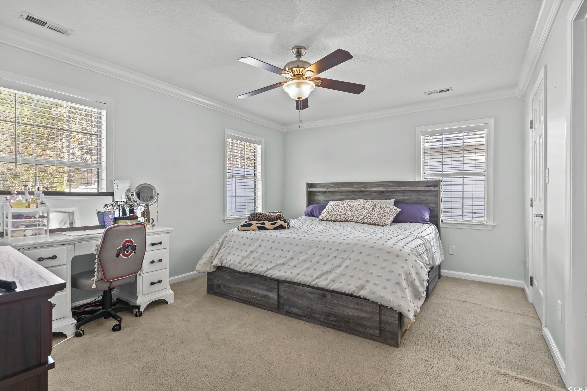 8010 Cone Court Murrells Inlet, SC 29576 - Photo 16 of 29 Bedroom with ornamental molding, a desk, light colored carpet, a ceiling fan, and a textured ceiling