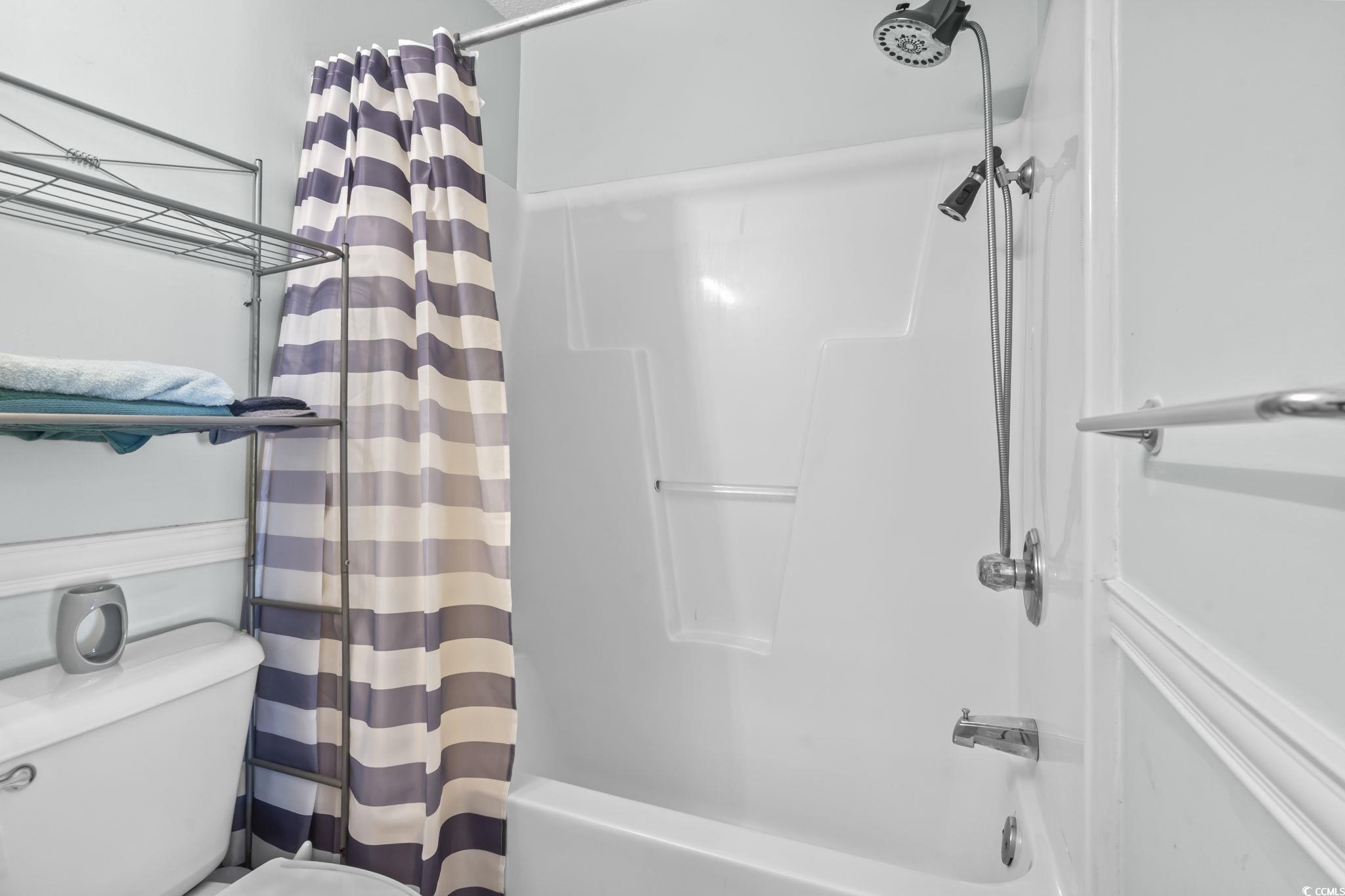 8010 Cone Court Murrells Inlet, SC 29576 - Photo 19 of 29 Full bath with shower / bathtub combination with curtain and toilet