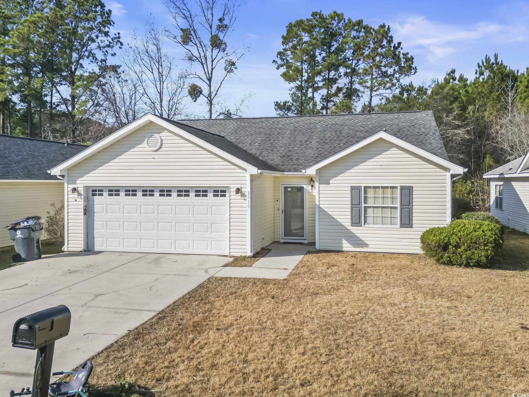 8010 Cone Court Murrells Inlet, SC 29576 - Photo 2 of 29 Ranch-style house with roof with shingles, driveway, a garage, and a front yard