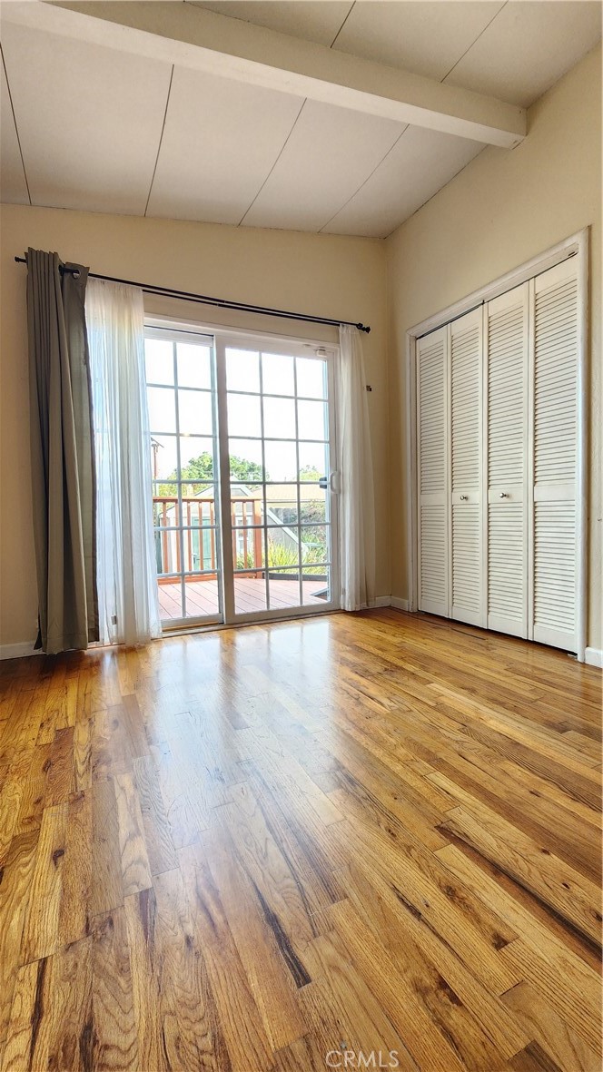 682 Taylor Street Monterey, CA 93940 - Photo 11 of 21 wooden floor in an empty room with a window