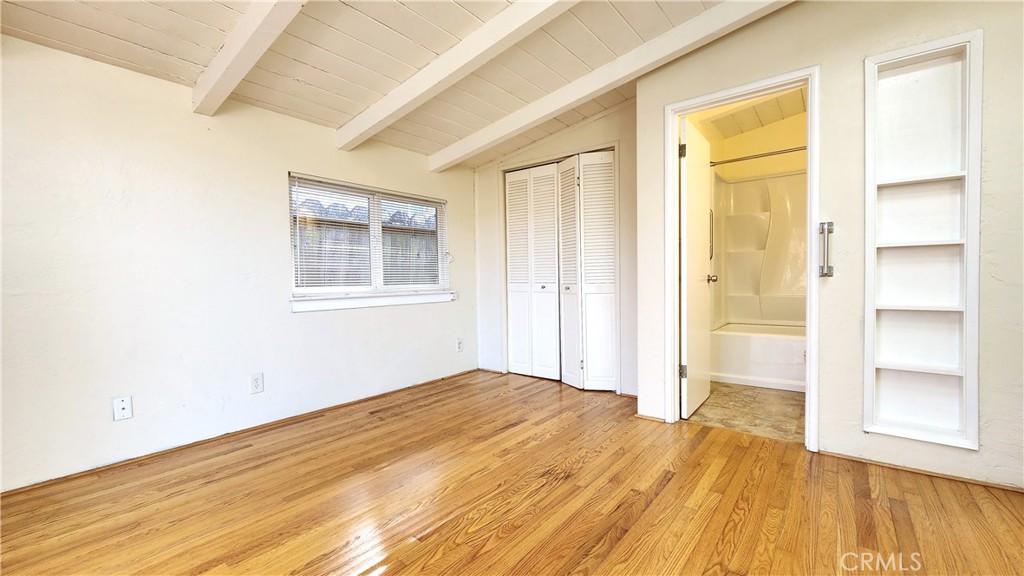 682 Taylor Street Monterey, CA 93940 - Photo 13 of 21 an empty room with wooden floor and windows