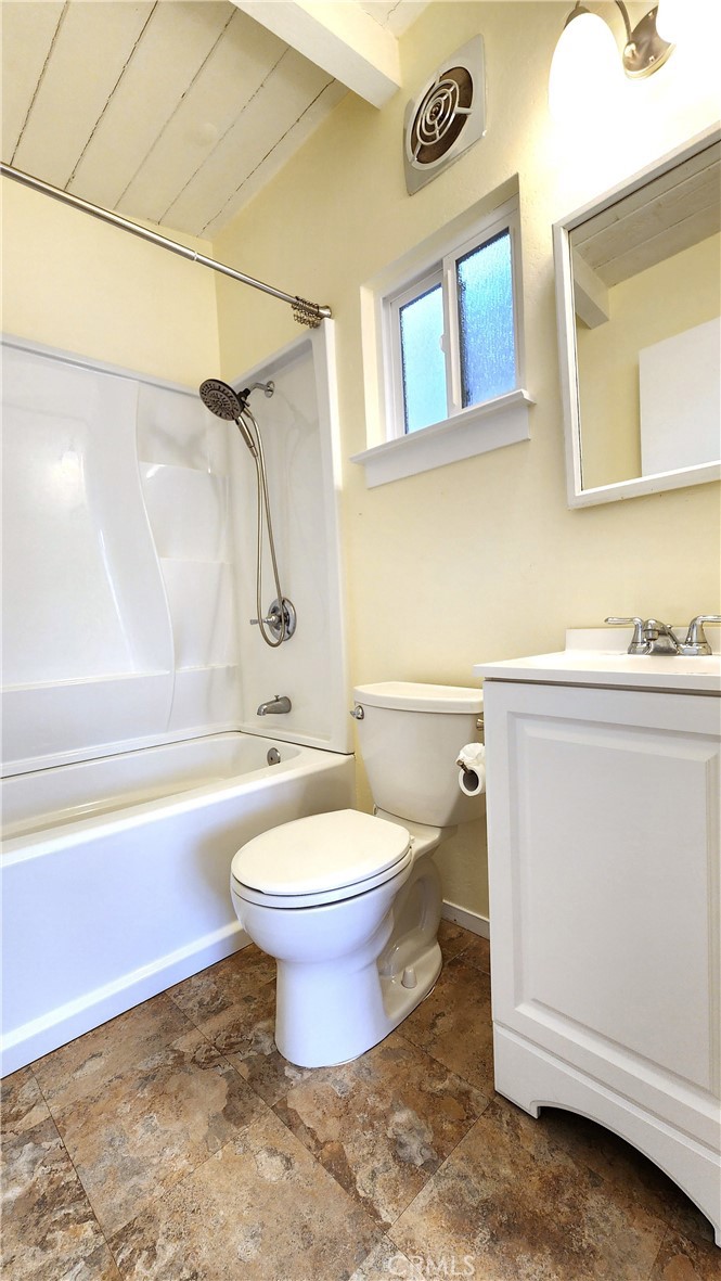 682 Taylor Street Monterey, CA 93940 - Photo 16 of 21 a bathroom with a granite countertop toilet a sink and bathtub