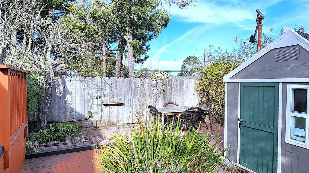 682 Taylor Street Monterey, CA 93940 - Photo 19 of 21 a view of a chair and table in backyard of the house
