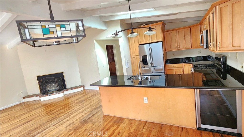 682 Taylor Street Monterey, CA 93940 - Photo 4 of 21 a kitchen with stainless steel appliances granite countertop a refrigerator a stove and a wooden floors