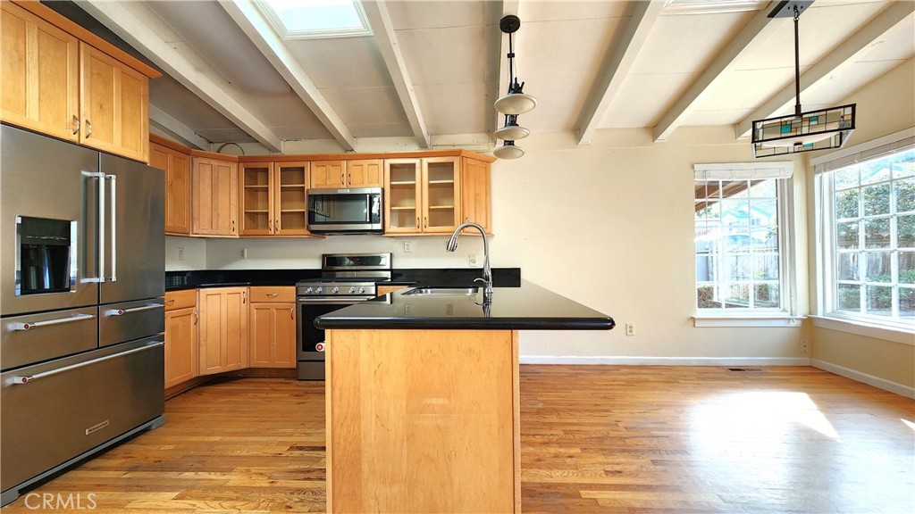 682 Taylor Street Monterey, CA 93940 - Photo 5 of 21 a kitchen with stainless steel appliances granite countertop a stove a sink and a microwave