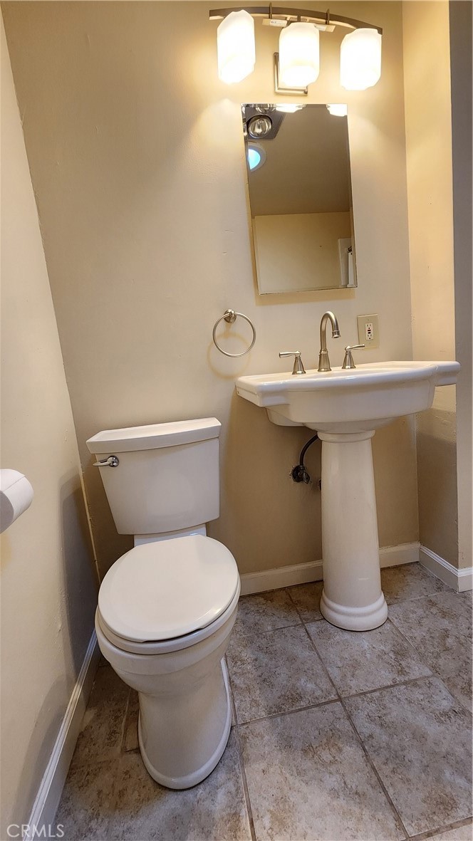 682 Taylor Street Monterey, CA 93940 - Photo 7 of 21 a bathroom with a sink toilet and mirror