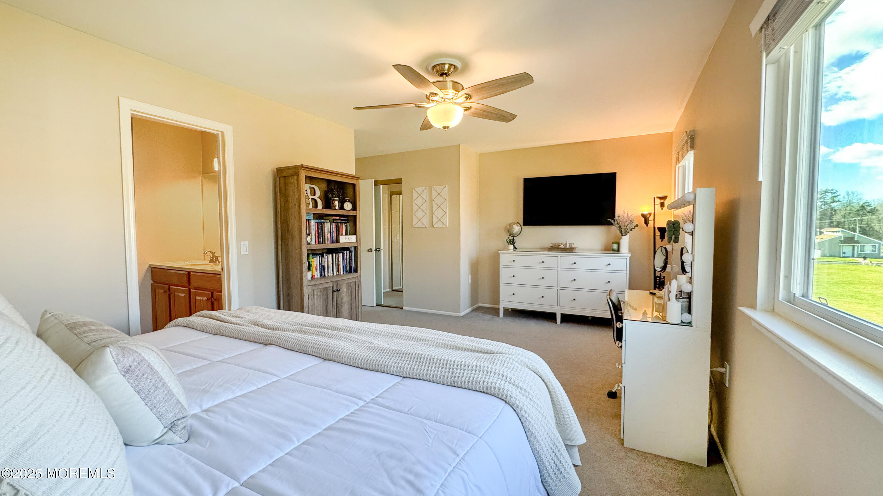 421 Sandra Place Brick, NJ 08724 - Photo 11 of 19 a bedroom with a bed window and a flat screen tv