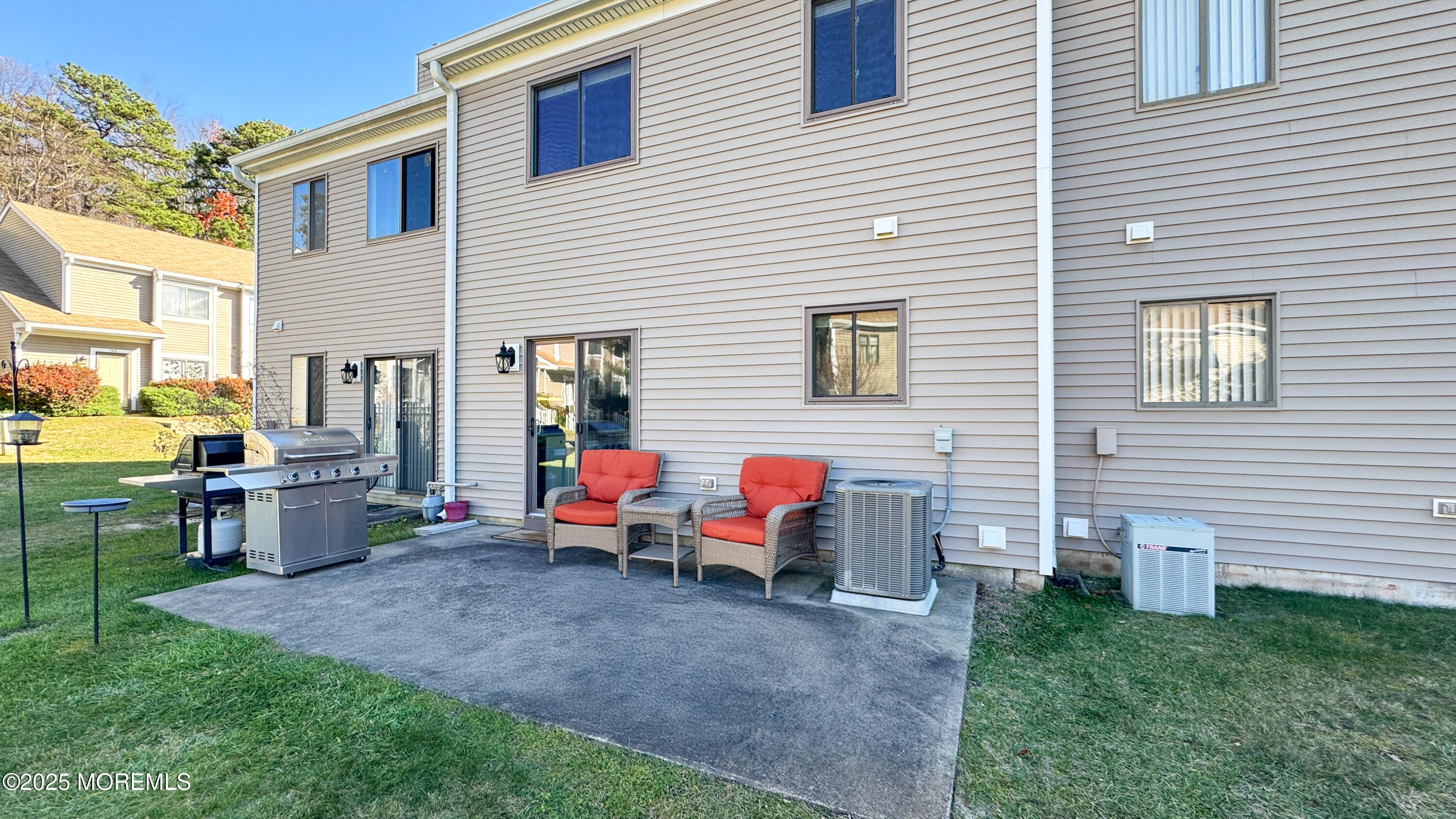 421 Sandra Place Brick, NJ 08724 - Photo 19 of 19 a backyard of a house with table and chairs