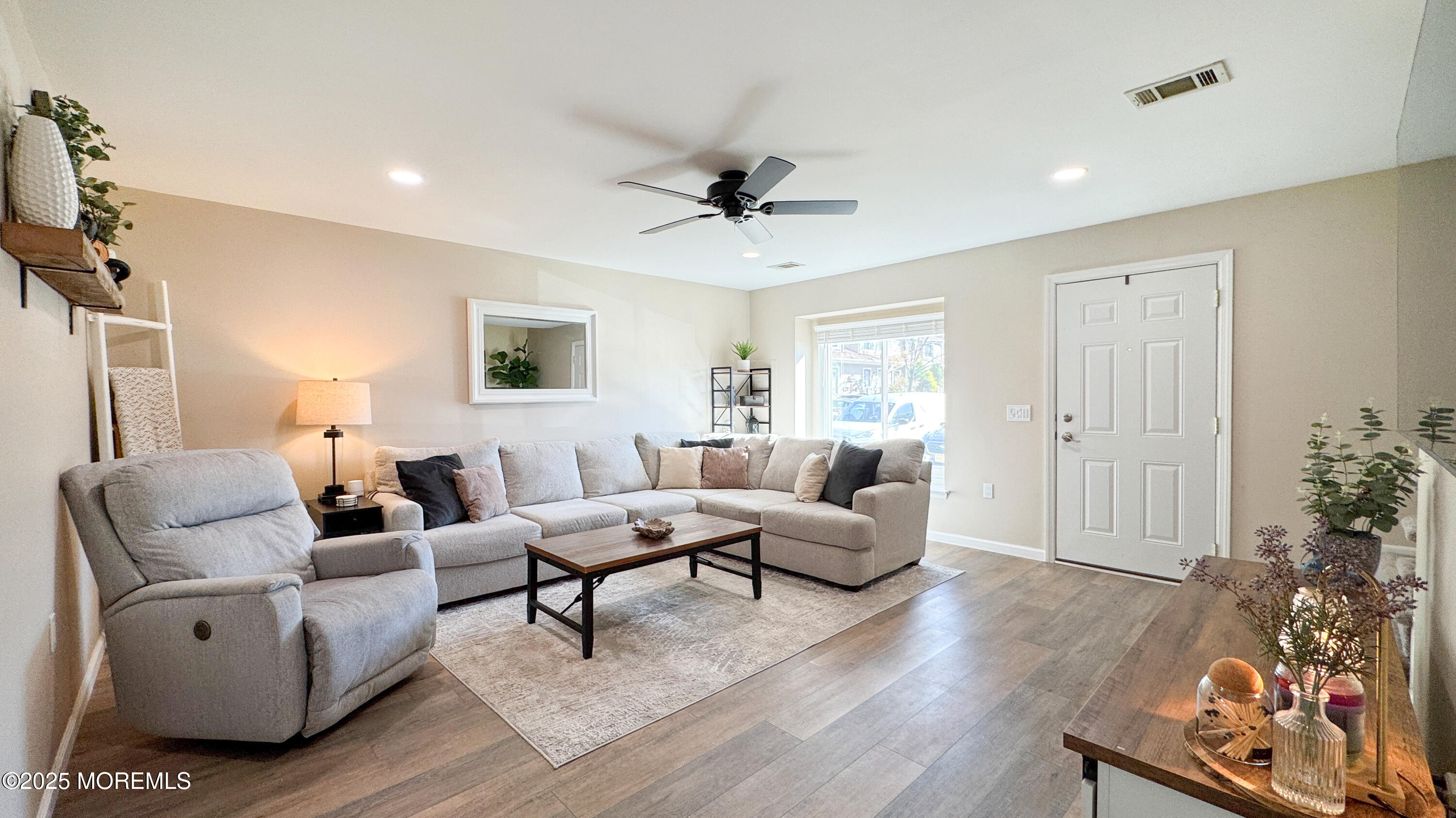 421 Sandra Place Brick, NJ 08724 - Photo 2 of 19 a living room with furniture or wooden floor and a window