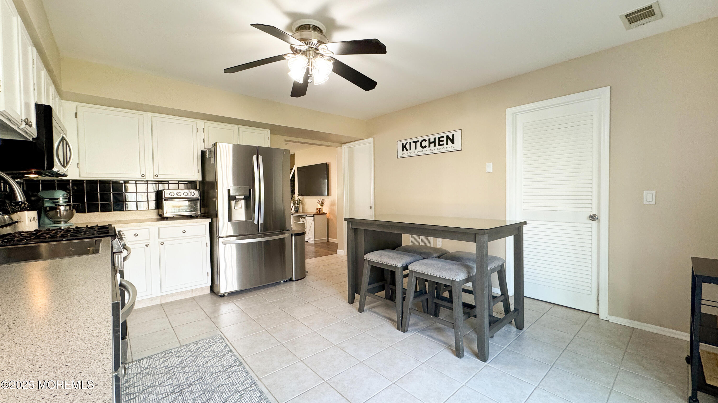 421 Sandra Place Brick, NJ 08724 - Photo 8 of 19 a kitchen with stainless steel appliances kitchen island granite countertop refrigerator and cabinets