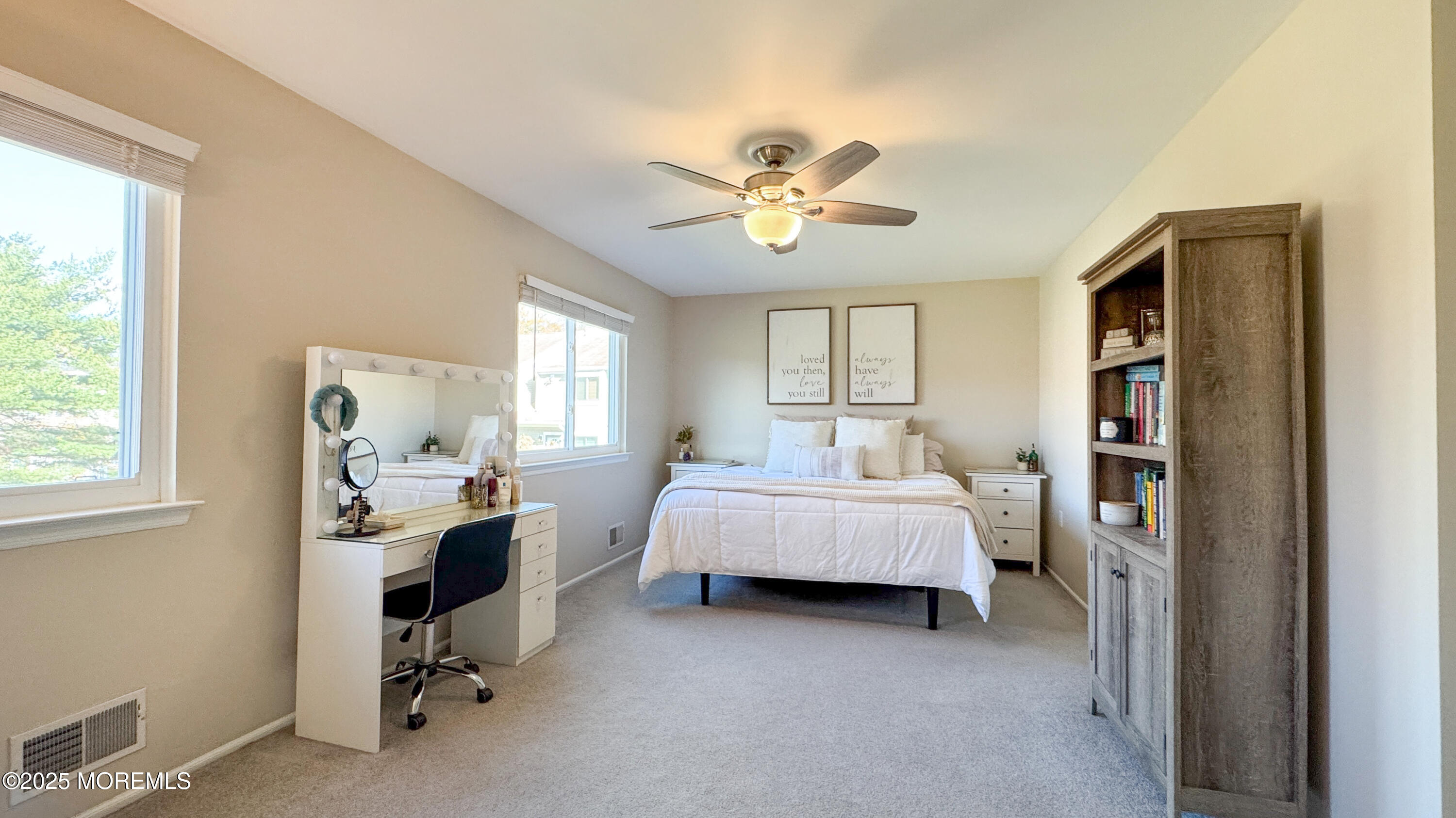 421 Sandra Place Brick, NJ 08724 - Photo 10 of 19 a spacious bedroom with a bed and a chandelier