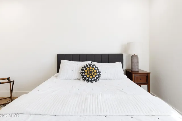 a large white bed in a small room