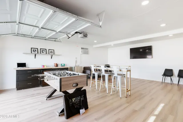 a living room with lots of furniture and wooden floor