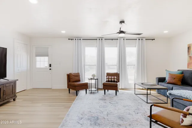 a bedroom with furniture water view and a window