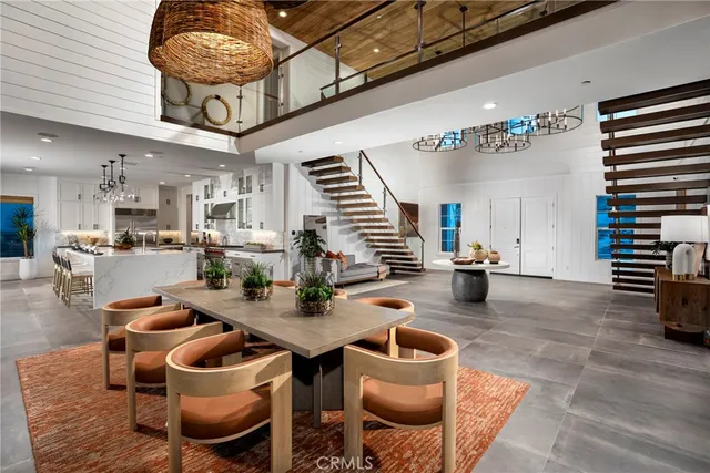 a kitchen with furniture and a chandelier