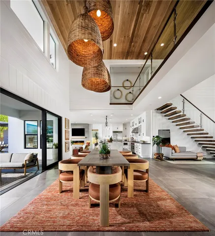 a living room with lots of furniture and a chandelier