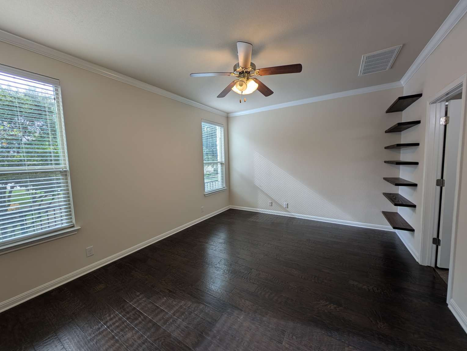 7301 Bandera Ranch Trail, Unit A Austin, TX 78750 - Photo 11 of 20 Rich hardwood floors complement the neutral walls and bright windows in this flexible space.