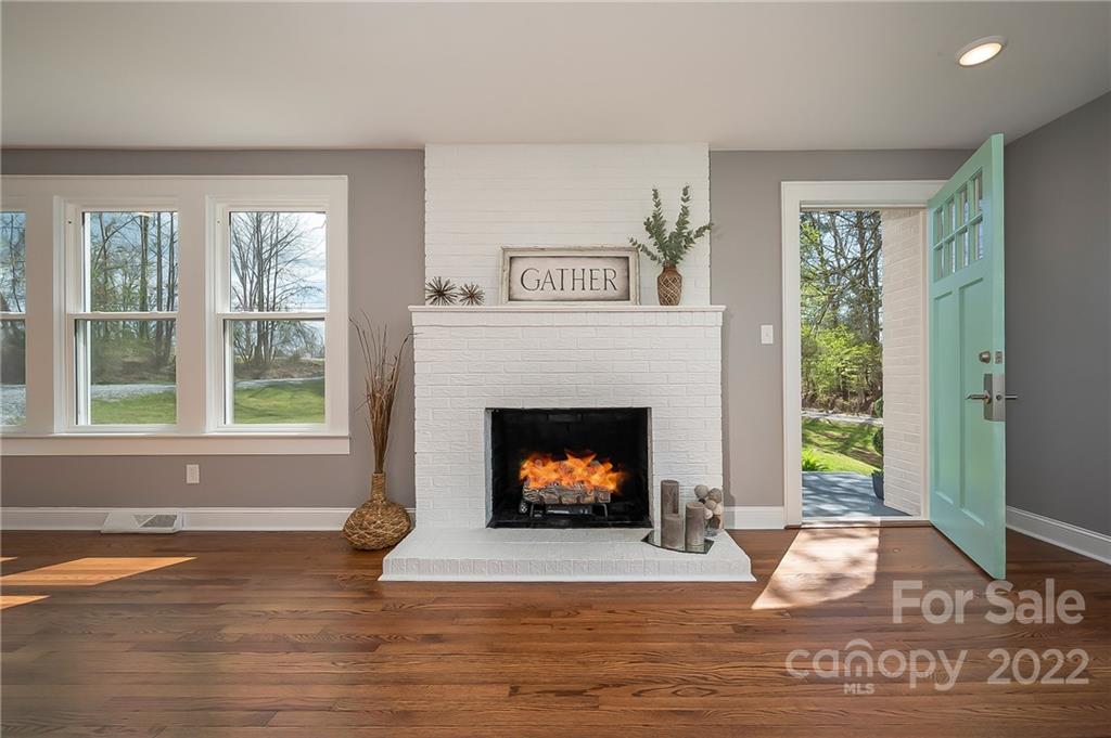 1141 Highway 64 Rutherfordton, NC 28139 - Photo 12 of 37 a living room with furniture and a fireplace