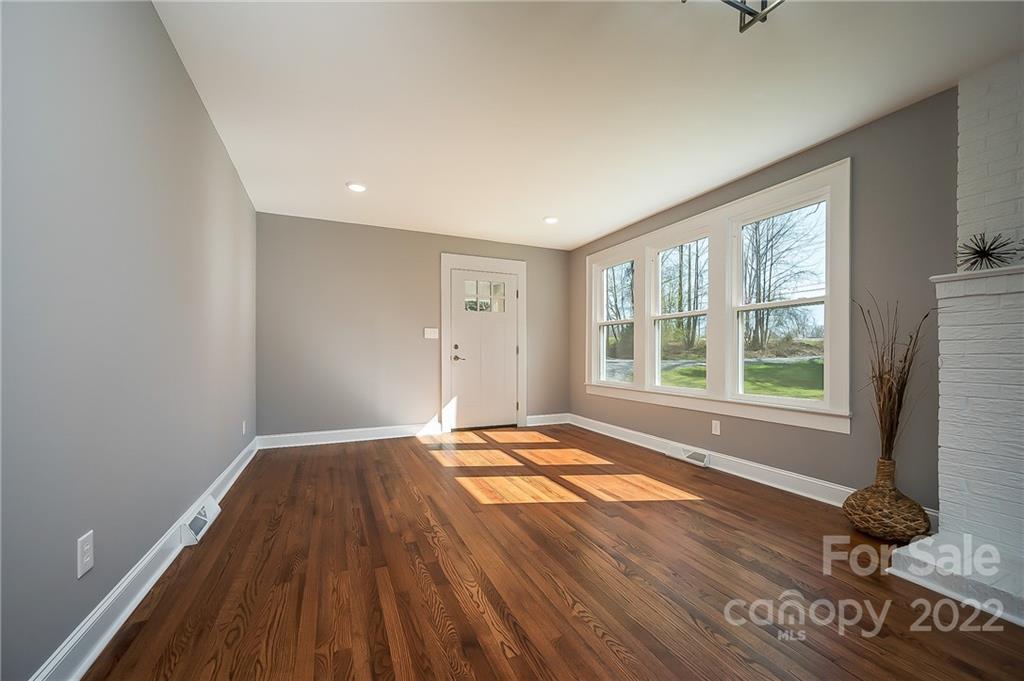 1141 Highway 64 Rutherfordton, NC 28139 - Photo 14 of 37 a view of an empty room with a window and wooden floor