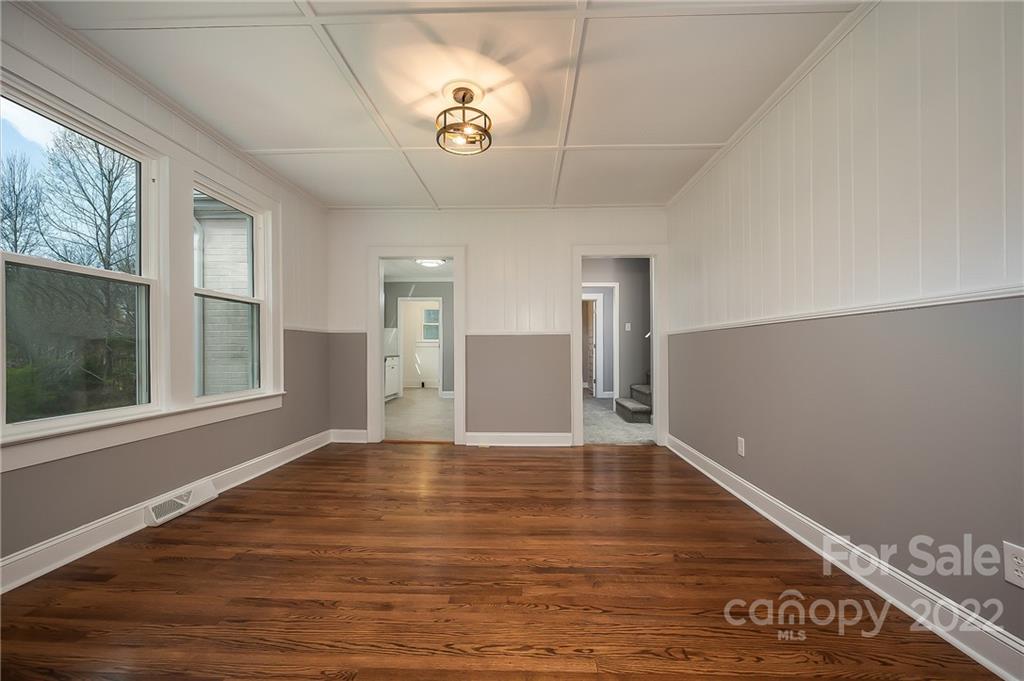 1141 Highway 64 Rutherfordton, NC 28139 - Photo 16 of 37 a view of an empty room with wooden floor and a window