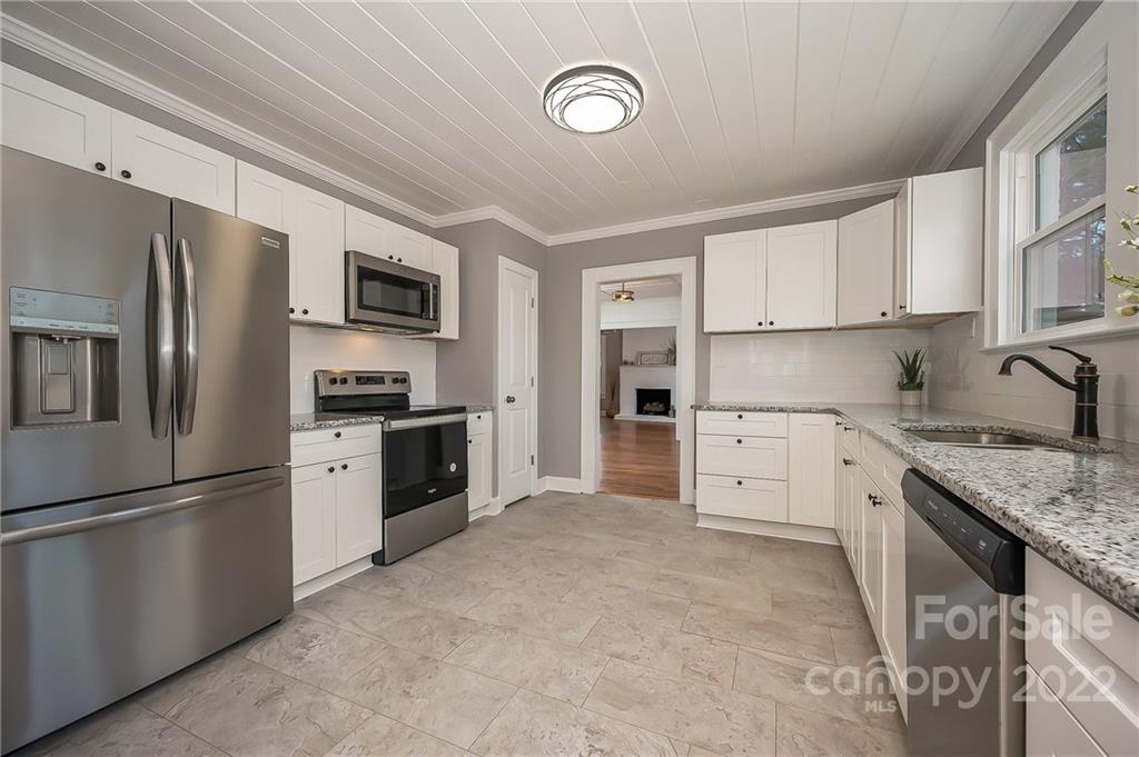 1141 Highway 64 Rutherfordton, NC 28139 - Photo 20 of 37 a kitchen with cabinets stainless steel appliances and a counter top space