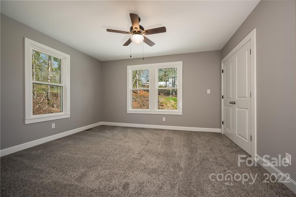 1141 Highway 64 Rutherfordton, NC 28139 - Photo 23 of 37 wooden floor in an empty room with a window